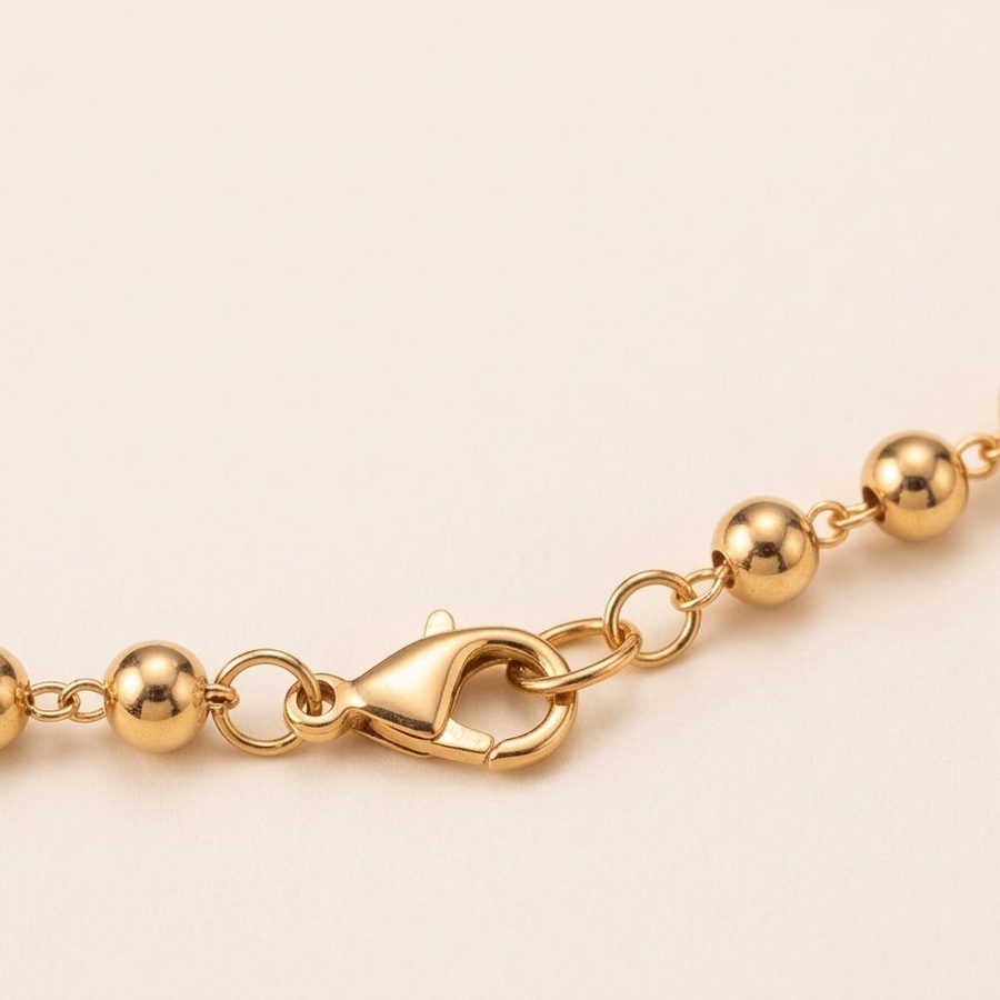 Gold rosary chain clasp detail