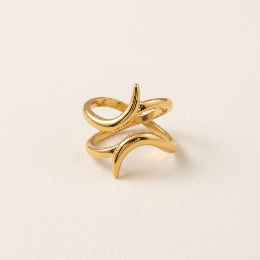 Crossed band ring flat lay