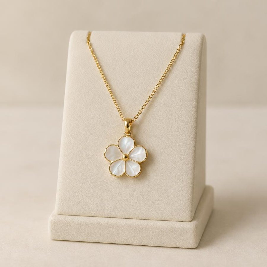 Necklace displayed on a cream jewellery stand