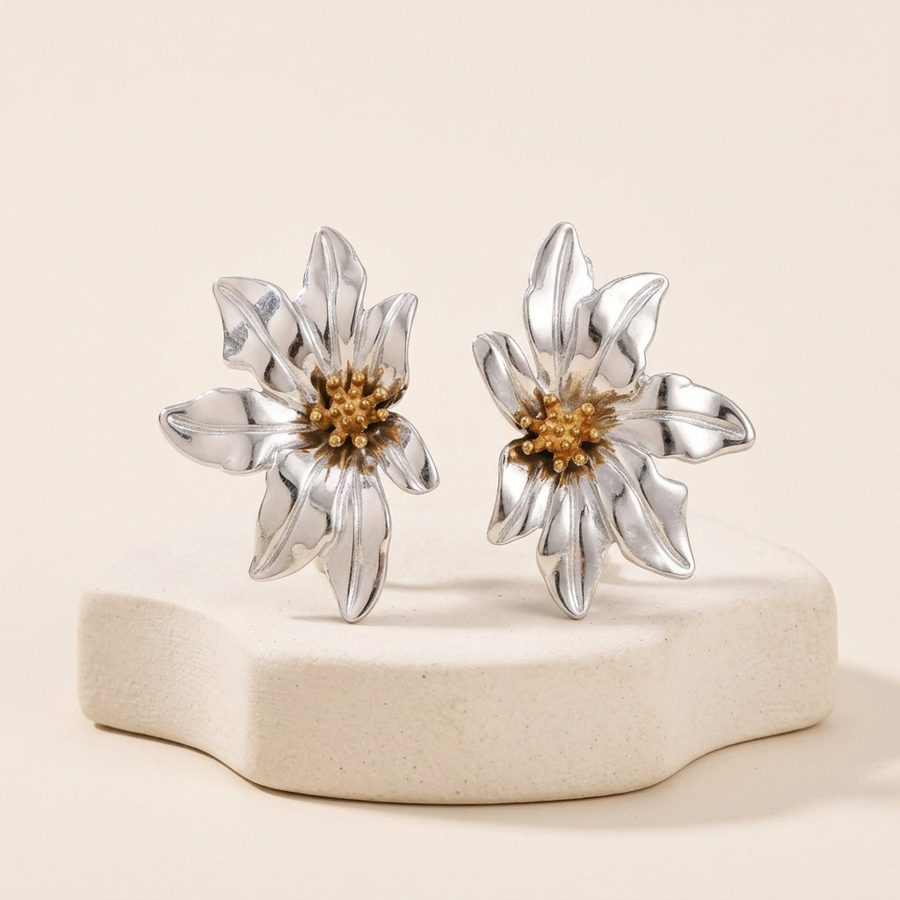 Flower stud earrings on ceramic riser