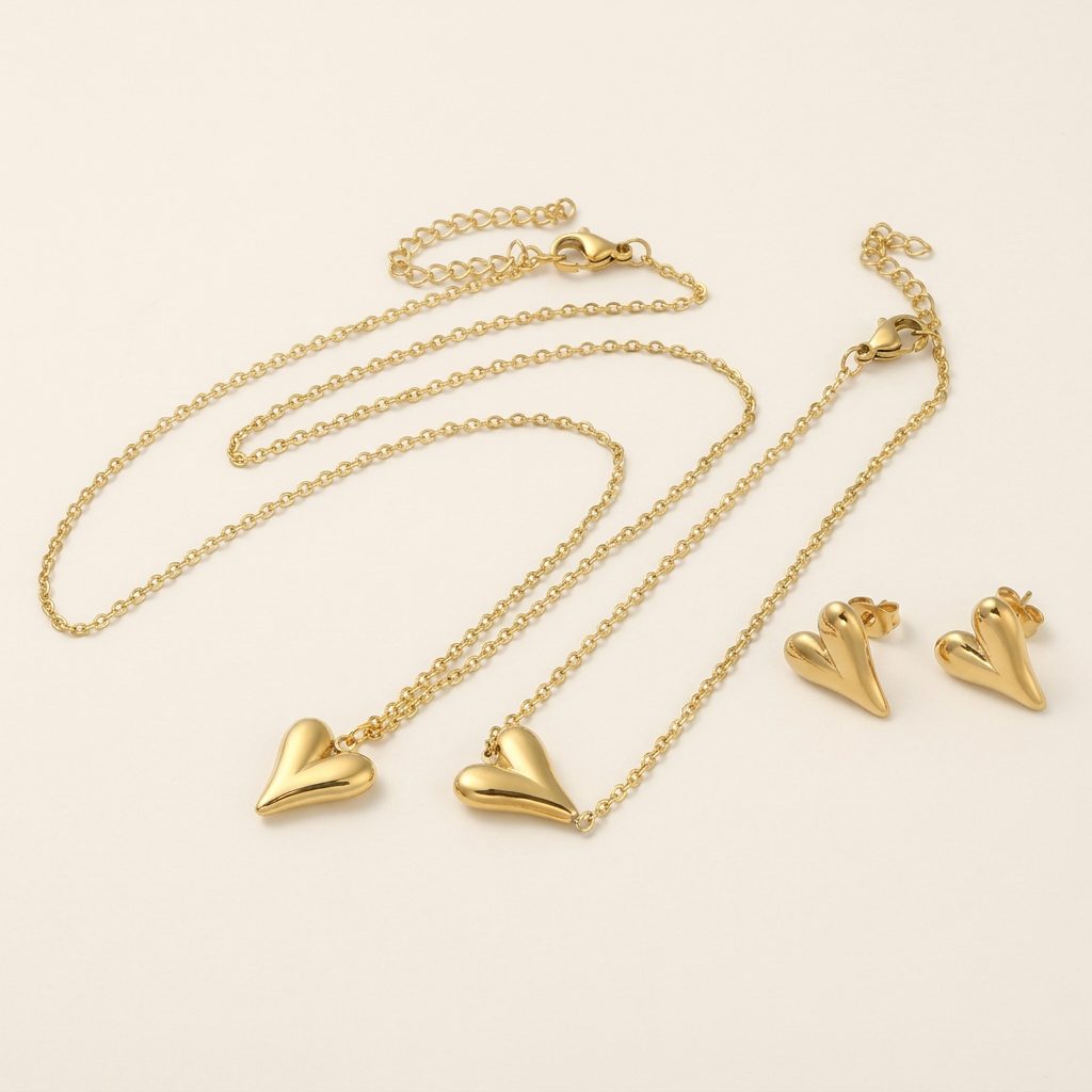 Angled view of gold heart jewellery set