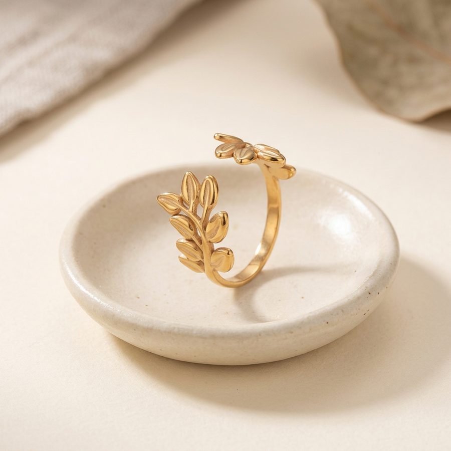 Olive branch ring on a ceramic dish
