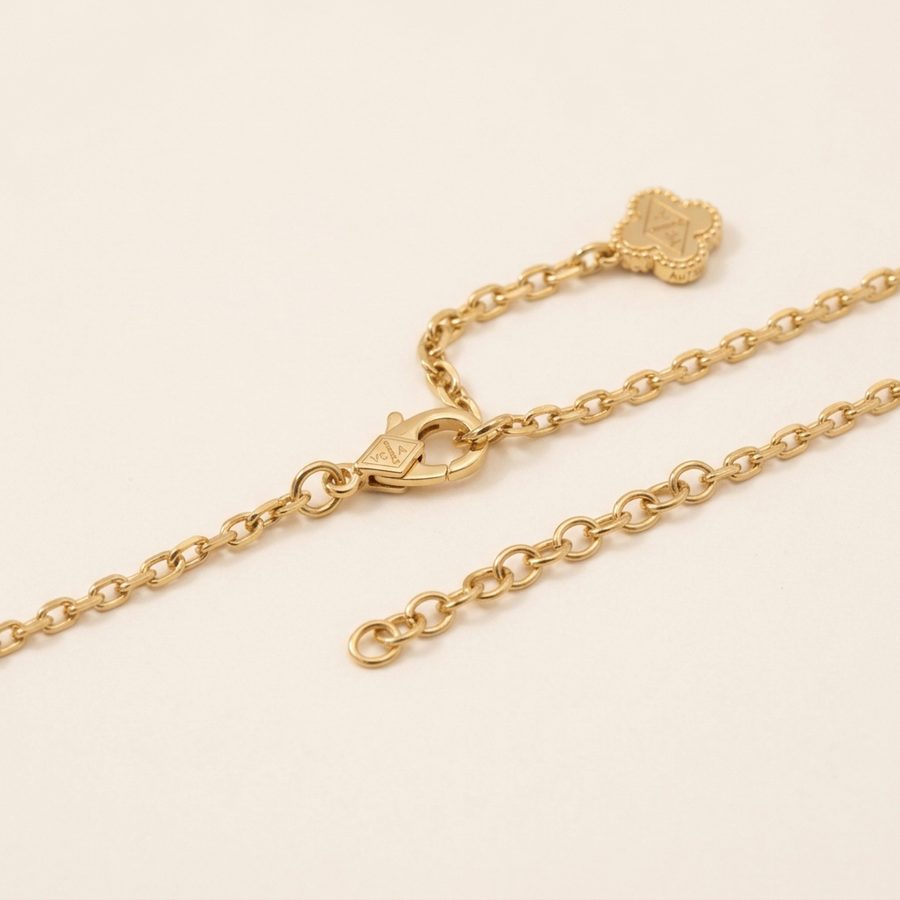 Gold-tone necklace clasp and extender detail